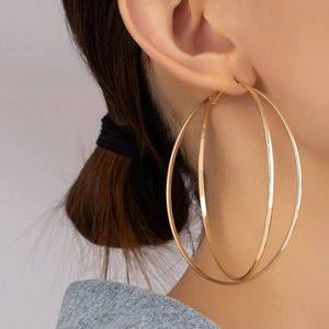 - Large gold hoops.